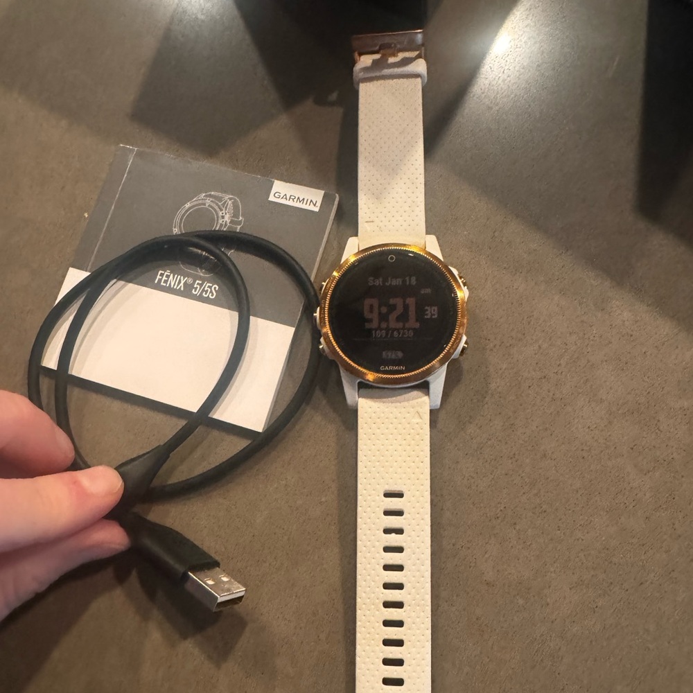 Garmin Fenix 5s Sapphire in Rose Gold and white smartwatch